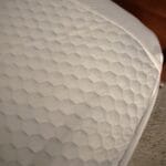 mattress topper placed on bed