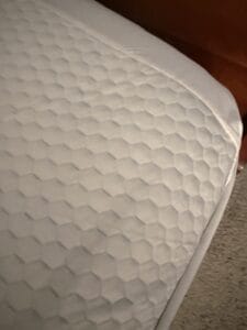 mattress topper placed on bed