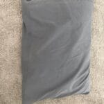 a pillow on a bedroom floor