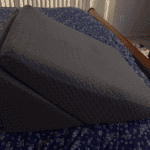 wedge pillow on bed