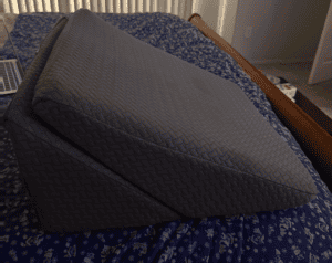 wedge pillow on bed