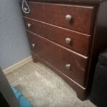 a nightstand in a bedroom