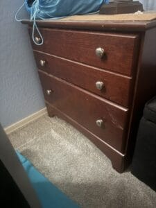 a nightstand in a bedroom