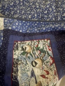 a quilt laid out on a bed