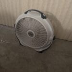 a bedside fan in bedroom