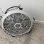 a bedside fan in bedroom