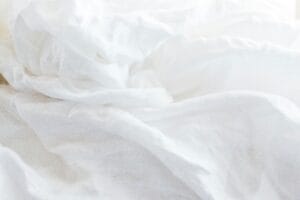 Wrinkled white fabric, soft texture.