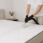 someone doing a mattress cleaning