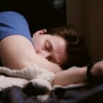 someone in a deep sleep at their home