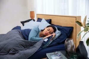Woman sleeping peacefully in bed.