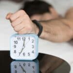 someone using their alarm while sleeping