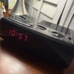 a standard digital alarm clock on nightstand