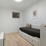 Minimalist room with trundle bed.