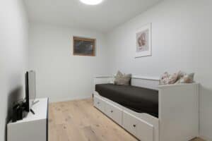 Minimalist room with trundle bed.