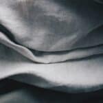 Soft, wrinkled gray linen fabric