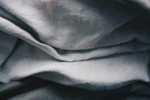 Soft, wrinkled gray linen fabric