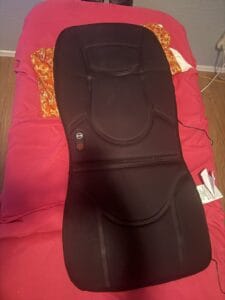 a back massager in home on massage table