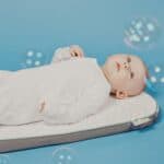 a bassinet mattress with baby