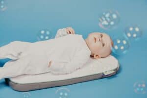 a bassinet mattress with baby