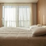 a minimal bedroom layout with mattress
