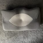 cervical pillow laying on floor