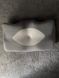 cervical pillow laying on floor