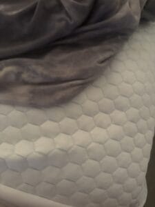 a cooling blanket next to a cooling topper