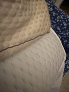 a cooling pillow and cooling mattress topper side by side