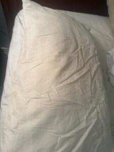 a cooling pillow on mattres shown in full