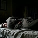 someone in deep sleep sleeping on their side
