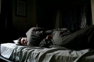 someone in deep sleep sleeping on their side