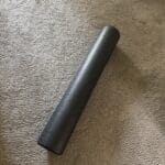 a diagonal foam roller on floor