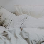 a duvet set up on bed