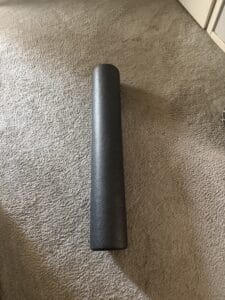 a foam roller in a bedroom