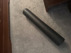 a foam roller for recovery in bed