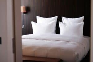 a set of hotel pillows set up in room