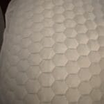 a laid out mattress topper for bed