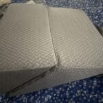a leg wedge pillow on bed