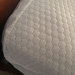 a cooling mattress topper on bed
