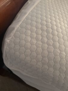 a cooling mattress topper on bed