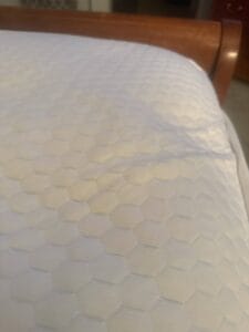 a mattress topper on bed
