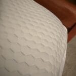 a sturdy mattress topper on bed