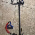 a pilates bar with bands for stretching