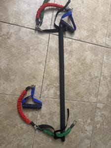 a pilates bar with bands for stretching