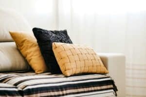 a lot of pillows on bed