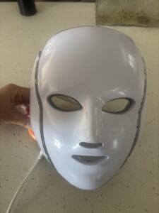 a red light mask for sleep on a counter