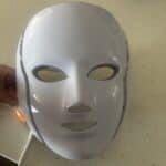 a red light therapy mask on counter