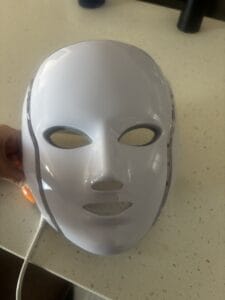 a red light therapy mask on counter