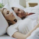 a couple sleeping in bed