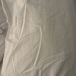 a satin pillowcase on a bed